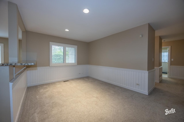 143 Midway Ln, Vernon Hills, IL 60061 - empty room featuring a healthy amount of sunlight, a wainscoted wall, recessed lighting, and light colored carpet
