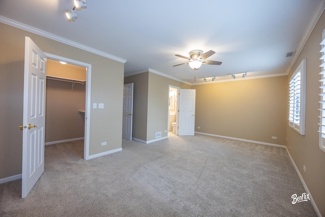 143 Midway Ln, Vernon Hills, IL 60061 - unfurnished bedroom featuring rail lighting, carpet, a spacious closet, visible vents, and ornamental molding