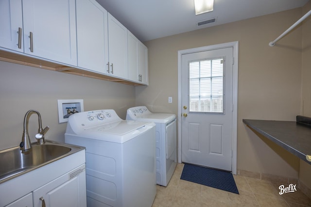143 Midway Ln, Vernon Hills, IL 60061 - laundry area featuring cabinet space, light tile patterned flooring, a sink, separate washer and dryer, and visible vents