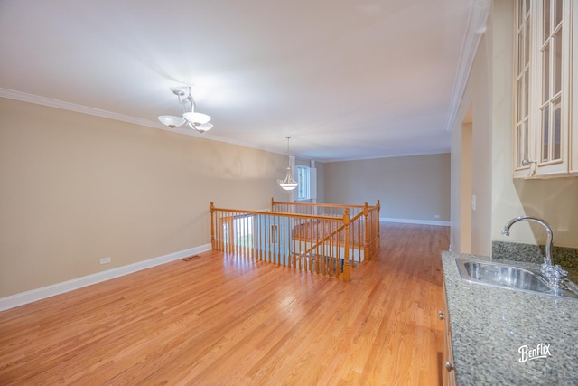 143 Midway Ln, Vernon Hills, IL 60061 - interior space with an inviting chandelier, ornamental molding, baseboards, light wood-type flooring, and a sink