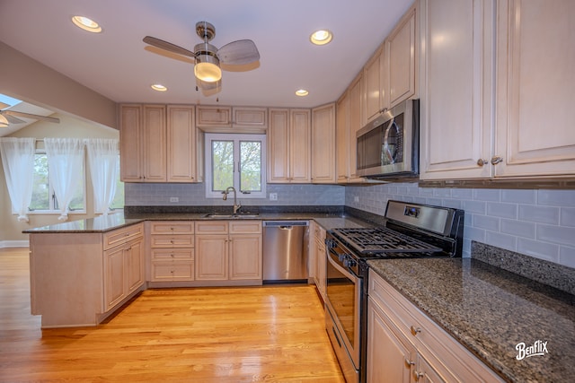 143 Midway Ln, Vernon Hills, IL 60061 - kitchen featuring a sink, ceiling fan, a peninsula, and stainless steel appliances