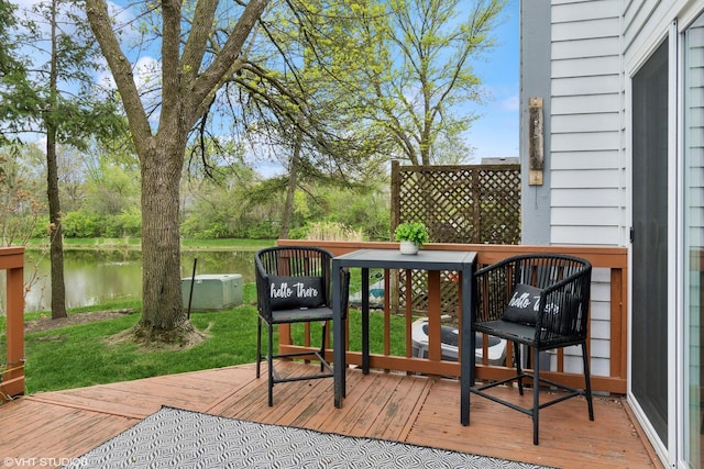 wooden deck featuring a water view