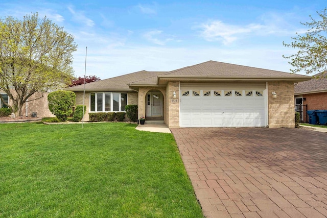 ranch-style house featuring roof with shingles, brick siding, a garage, a front yard, and decorative driveway