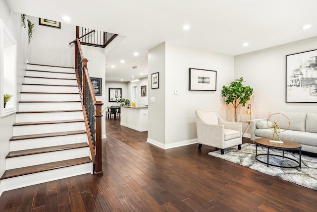 living area with stairway, baseboards, wood-type flooring, and recessed lighting