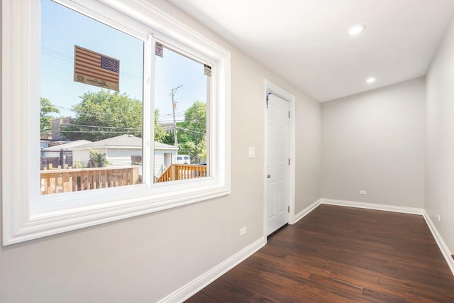 entryway featuring recessed lighting, baseboards, dark wood finished floors, and a wealth of natural light