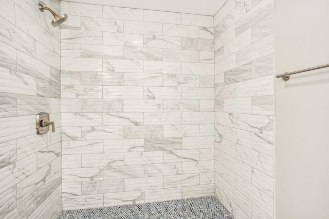 full bath featuring tiled shower