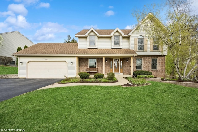 1210 Spring Hill Dr, Algonquin, IL 60102 - traditional home with a porch, driveway, roof with shingles, a front lawn, and an attached garage