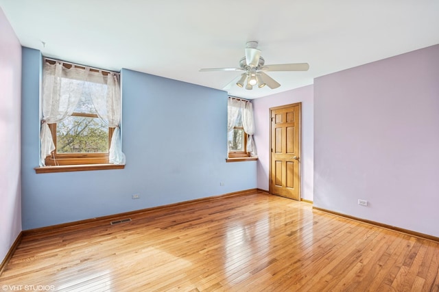 1210 Spring Hill Dr, Algonquin, IL 60102 - empty room featuring a wealth of natural light, wood-type flooring, ceiling fan, and visible vents