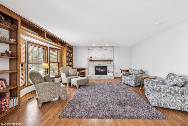 1210 Spring Hill Dr, Algonquin, IL 60102 - living area featuring visible vents, recessed lighting, a brick fireplace, and wood finished floors