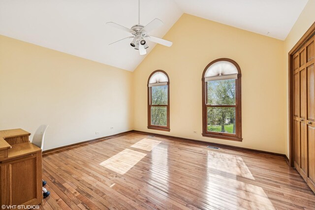 1210 Spring Hill Dr, Algonquin, IL 60102 - unfurnished bedroom with high vaulted ceiling, visible vents, baseboards, and light wood-type flooring