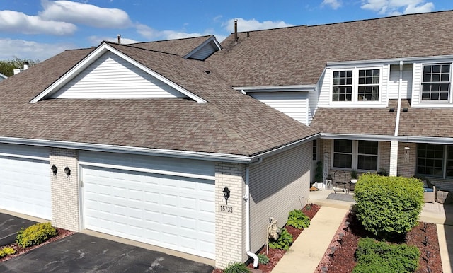 15733 Liberty Ct, Orland Park, IL 60462 - view of front of home with roof with shingles, brick siding, a garage, and driveway
