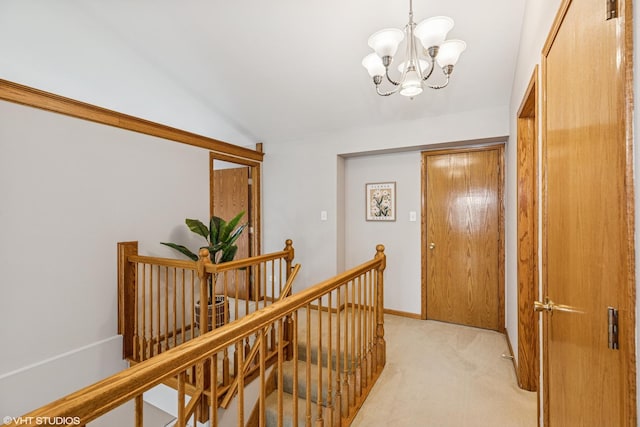 15733 Liberty Ct, Orland Park, IL 60462 - corridor with vaulted ceiling, an inviting chandelier, light carpet, and an upstairs landing