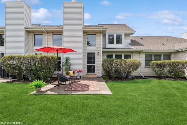 15733 Liberty Ct, Orland Park, IL 60462 - rear view of house featuring a chimney, a lawn, a patio area, and roof with shingles