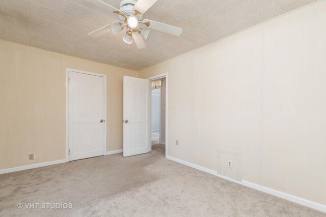 27569 N Beech St, Island Lake, IL 60042 - unfurnished bedroom with carpet, baseboards, and a ceiling fan