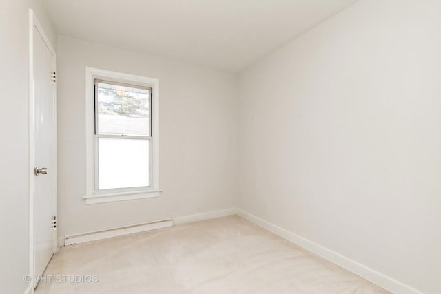 27569 N Beech St, Island Lake, IL 60042 - spare room with light colored carpet, baseboards, and a baseboard radiator