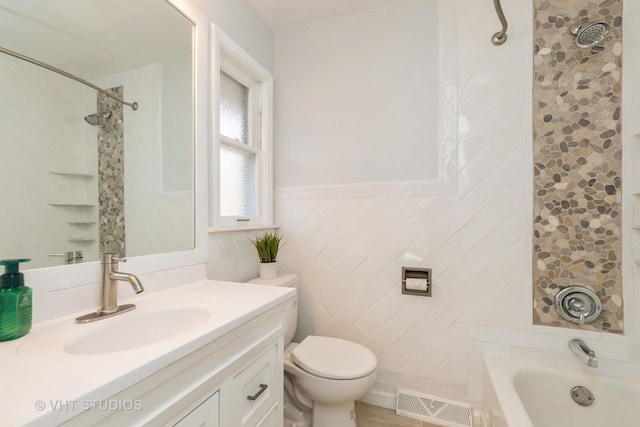 27569 N Beech St, Island Lake, IL 60042 - bathroom with vanity, toilet, tile walls, and shower / bathtub combination