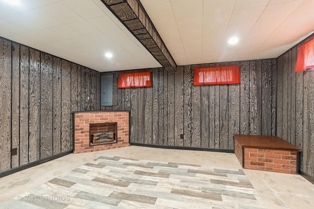 27569 N Beech St, Island Lake, IL 60042 - finished below grade area with wooden walls, electric panel, recessed lighting, and a fireplace