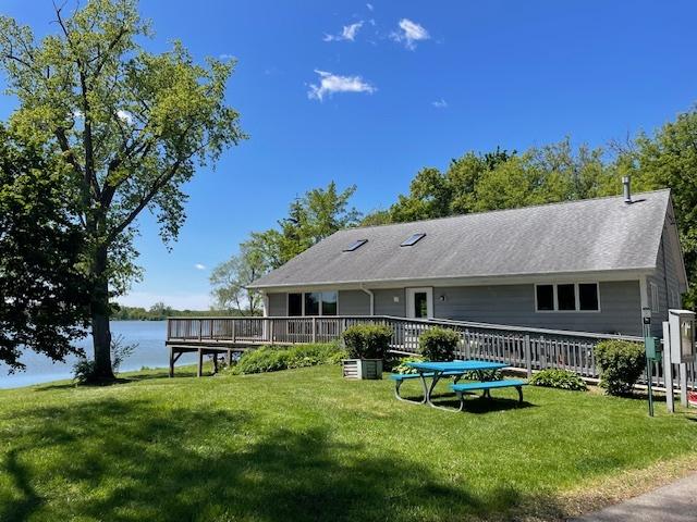 27569 N Beech St, Island Lake, IL 60042 - back of property with a lawn and a deck with water view
