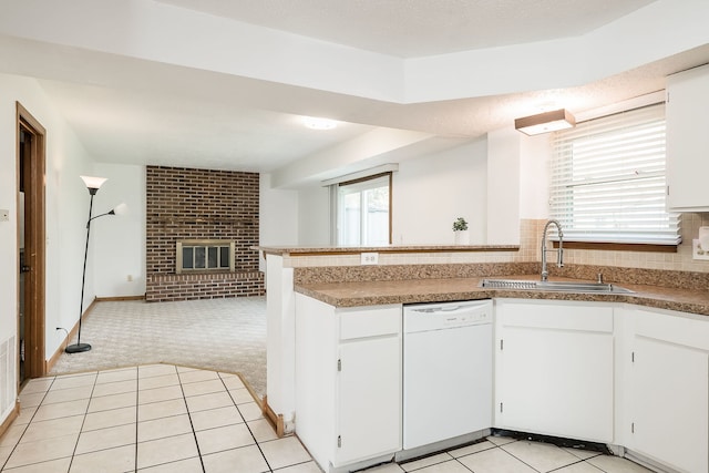kitchen with light carpet, a sink, dishwasher, white cabinetry, and open floor plan