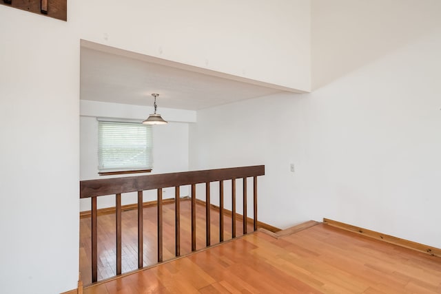 stairs featuring baseboards and wood finished floors