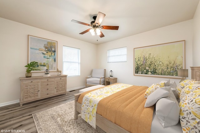 bedroom with baseboards, a ceiling fan, and wood finished floors