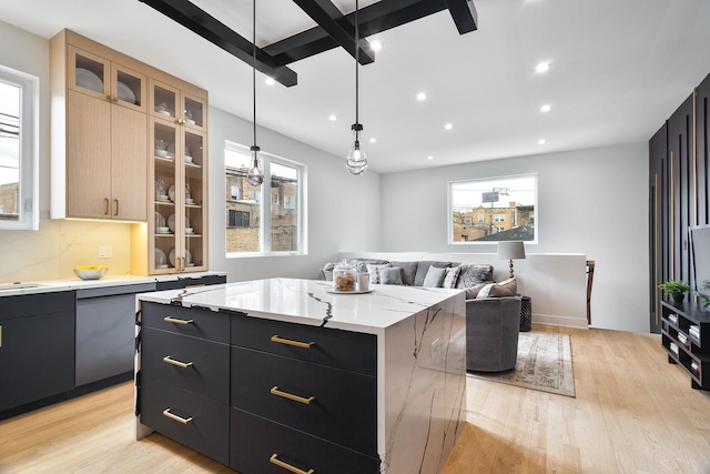 4014 N Kimball Ave, Chicago, IL 60618 - kitchen with dark cabinets, light wood-style floors, a kitchen island, and recessed lighting