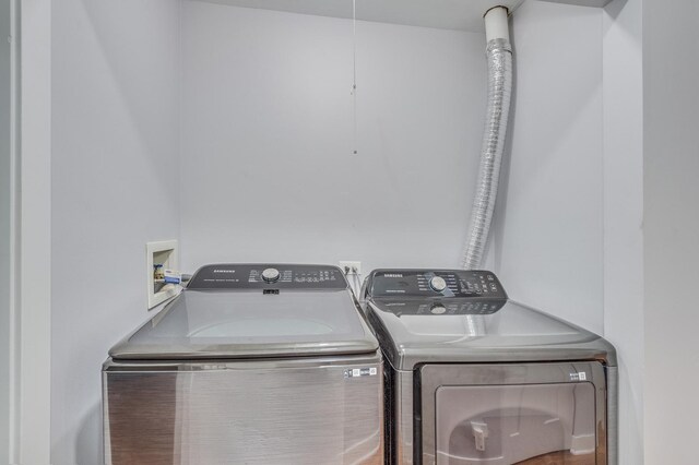laundry room featuring laundry area and washing machine and clothes dryer