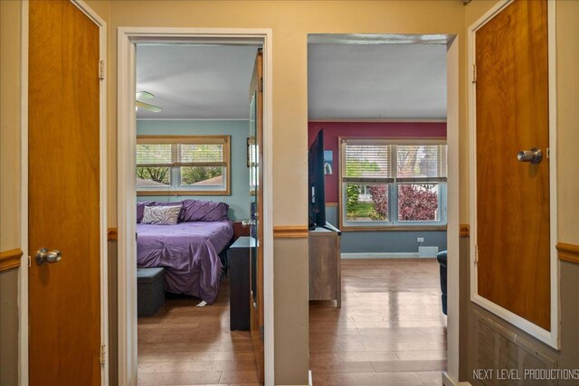 3005 Starling Ln, Rolling Meadows, IL 60008 - bedroom with multiple windows, hardwood / wood-style floors, and baseboards