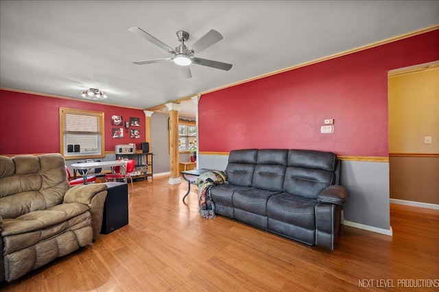 3005 Starling Ln, Rolling Meadows, IL 60008 - living area featuring a ceiling fan, ornate columns, wood finished floors, and baseboards
