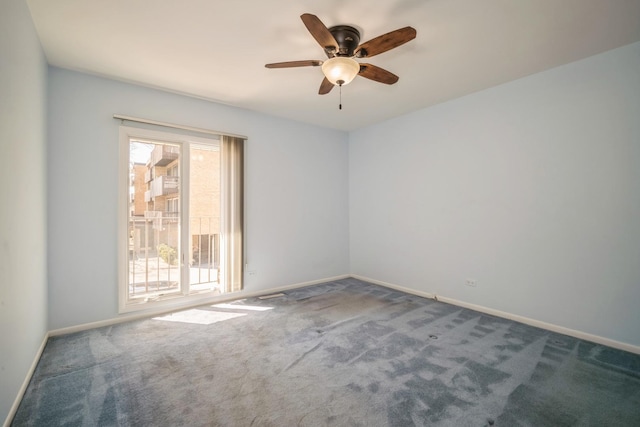 empty room featuring carpet flooring, a ceiling fan, and baseboards