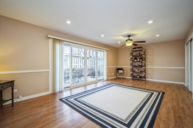 interior space featuring baseboards, ceiling fan, recessed lighting, and wood finished floors