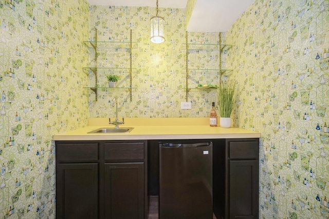 bathroom with a sink and wallpapered walls