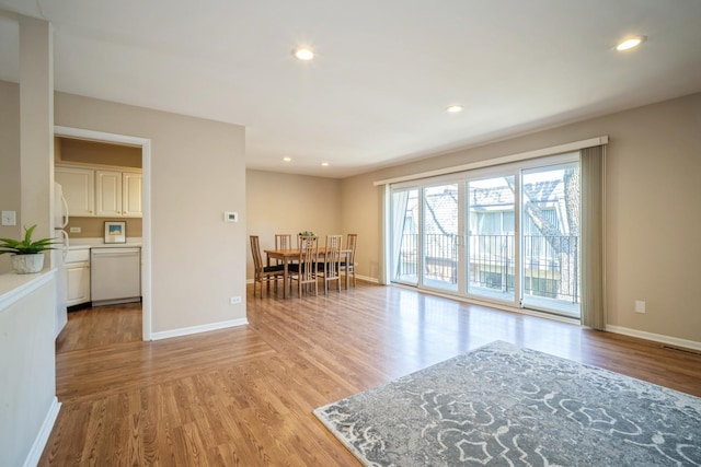 interior space with recessed lighting, baseboards, visible vents, and light wood-type flooring