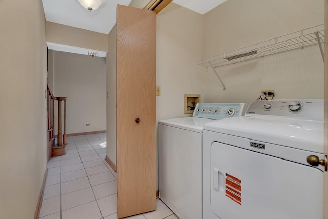7017 Plymouth Ct, Tinley Park, IL 60477 - laundry area with laundry area, washer and clothes dryer, baseboards, and light tile patterned flooring