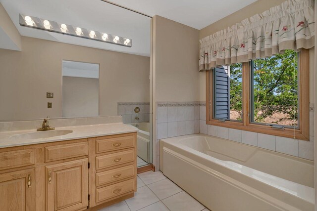 7017 Plymouth Ct, Tinley Park, IL 60477 - full bath featuring vanity, a bath, and tile patterned floors