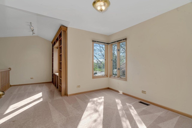 7017 Plymouth Ct, Tinley Park, IL 60477 - empty room with visible vents, baseboards, lofted ceiling, and carpet floors