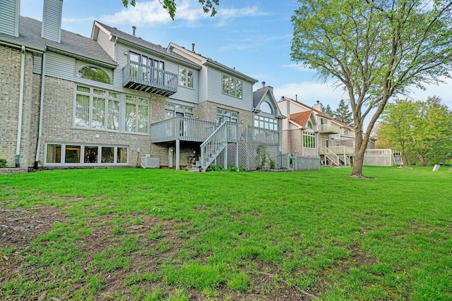 7017 Plymouth Ct, Tinley Park, IL 60477 - rear view of property featuring a residential view, a deck, a lawn, stairway, and brick siding