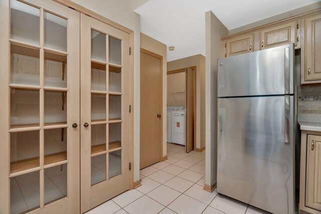7017 Plymouth Ct, Tinley Park, IL 60477 - kitchen with freestanding refrigerator, french doors, light tile patterned flooring, cream cabinetry, and light countertops