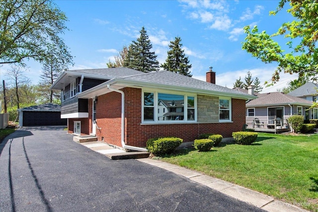 4430 Roslyn Rd, Downers Grove, IL 60515 - view of front of home featuring a chimney, brick siding, an outdoor structure, a garage, and a front lawn