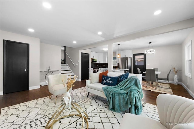 4430 Roslyn Rd, Downers Grove, IL 60515 - living room featuring a notable chandelier, recessed lighting, baseboards, stairs, and wood finished floors
