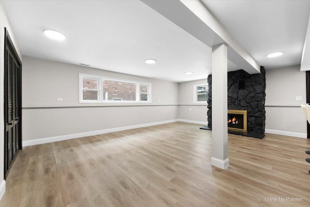 4430 Roslyn Rd, Downers Grove, IL 60515 - below grade area with a fireplace, light wood finished floors, baseboards, and visible vents