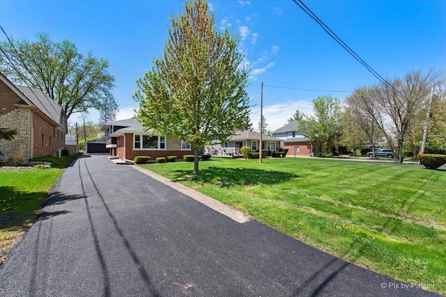4430 Roslyn Rd, Downers Grove, IL 60515 - view of front of house with a front yard and brick siding
