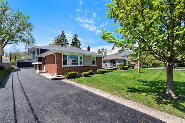4430 Roslyn Rd, Downers Grove, IL 60515 - view of front of property with brick siding, a garage, a front yard, entry steps, and a chimney