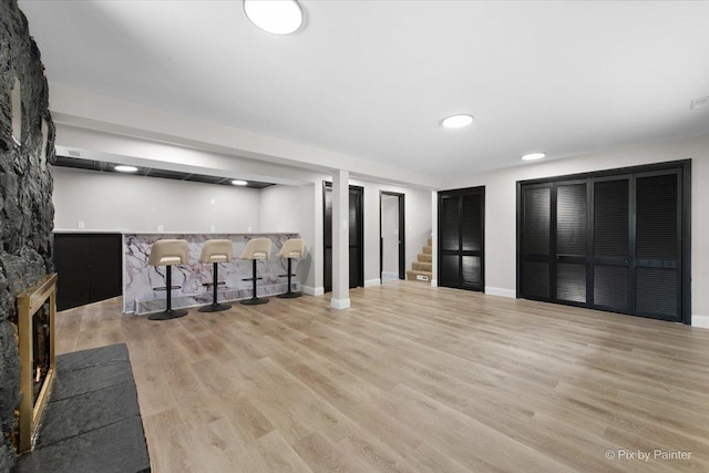 4430 Roslyn Rd, Downers Grove, IL 60515 - finished below grade area featuring stairs, baseboards, indoor bar, and wood finished floors