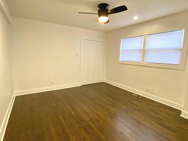 unfurnished room featuring dark wood-style flooring, ceiling fan, recessed lighting, baseboards, and visible vents