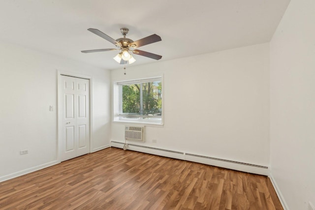 8440 Skokie Blvd Unit 102, Skokie, IL 60077 - unfurnished room with a baseboard radiator, wood finished floors, a ceiling fan, and baseboards