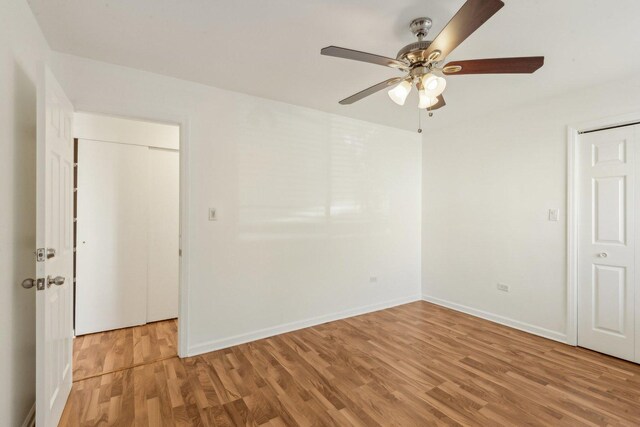 8440 Skokie Blvd Unit 102, Skokie, IL 60077 - empty room featuring light wood-style floors, ceiling fan, and baseboards