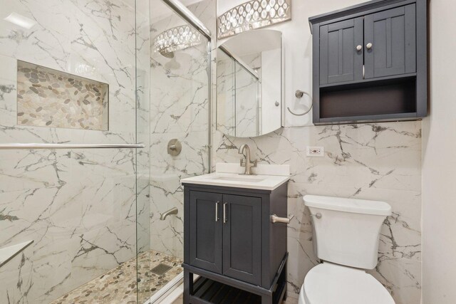 8440 Skokie Blvd Unit 102, Skokie, IL 60077 - full bathroom featuring a marble finish shower, toilet, vanity, and tile walls