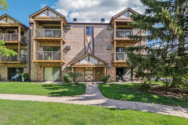 829 S Dwyer Ave Unit B, Arlington Heights, IL 60005 - view of front facade with brick siding and a front lawn