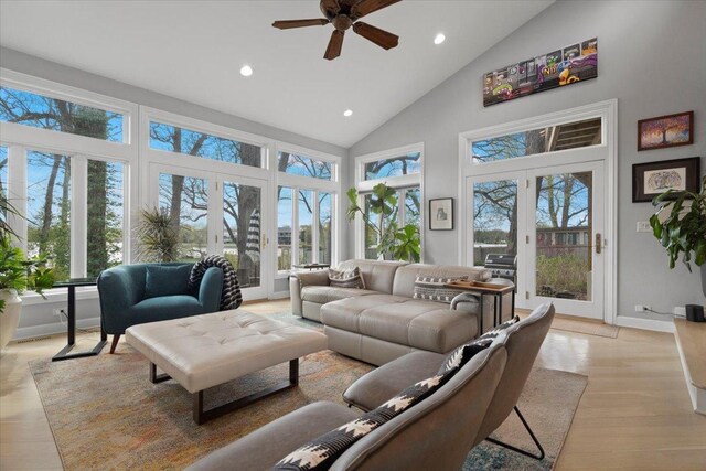 living room featuring recessed lighting, plenty of natural light, ceiling fan, and high vaulted ceiling